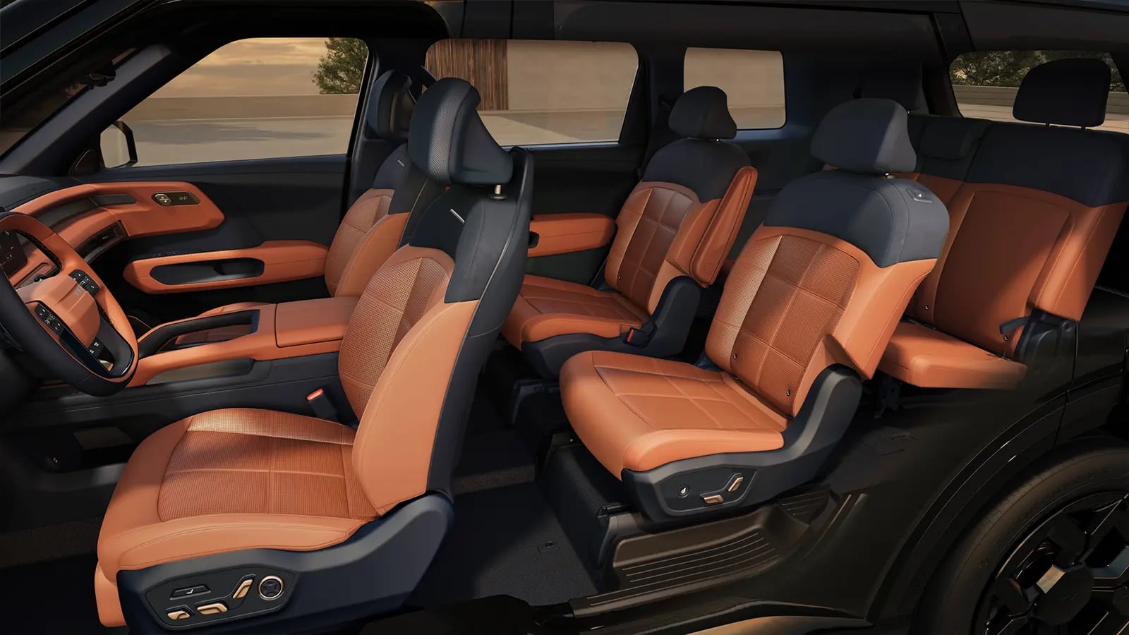 Three-row SUV interior with tan and navy seating