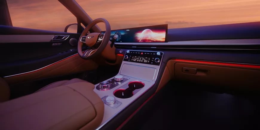 Genesis GV80 Coupe interior with leather seating and a wide digital display