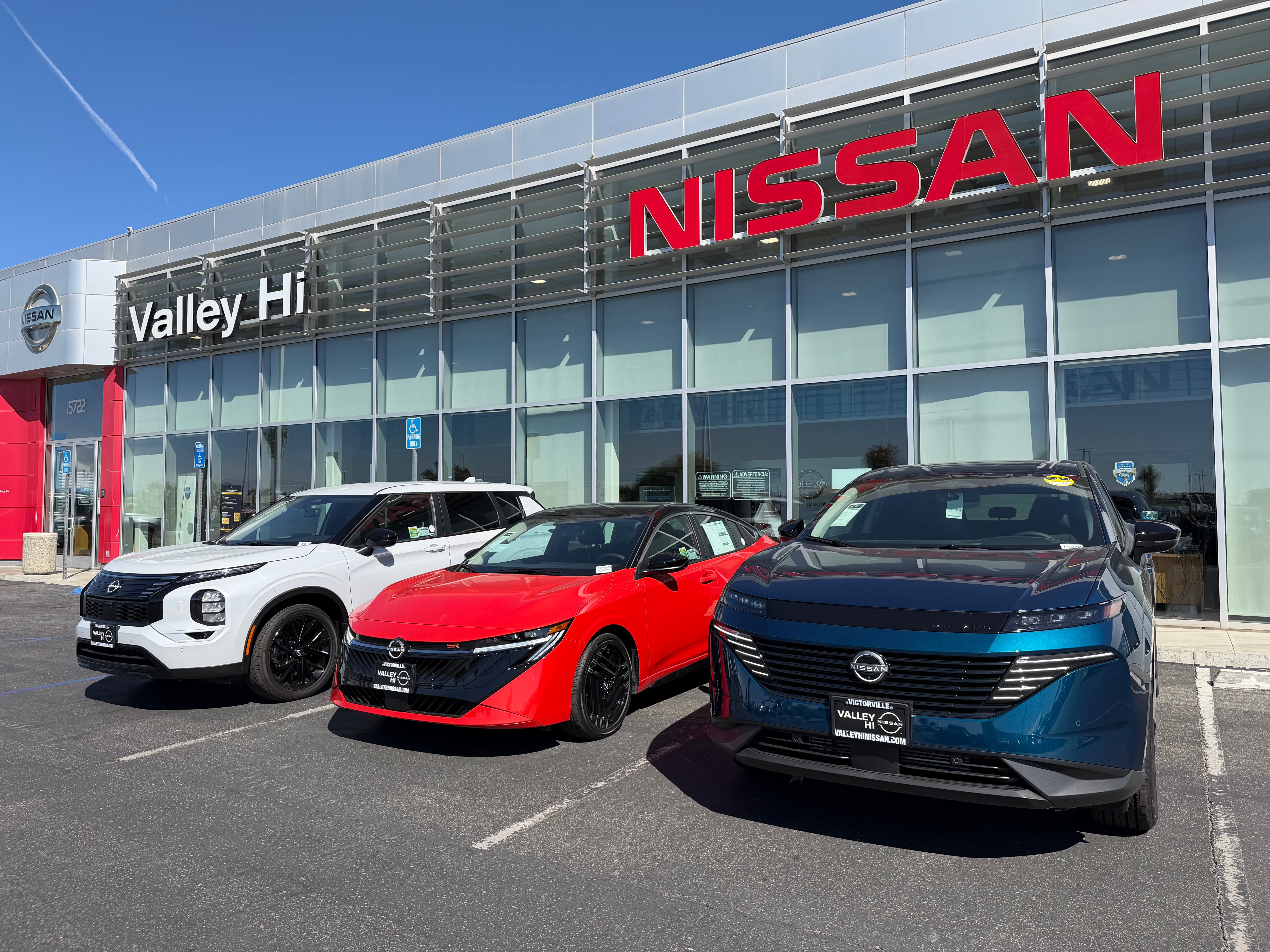 New Nissan vehicles parked outside the Valley Hi Nissan dealership in Victorville, CA
