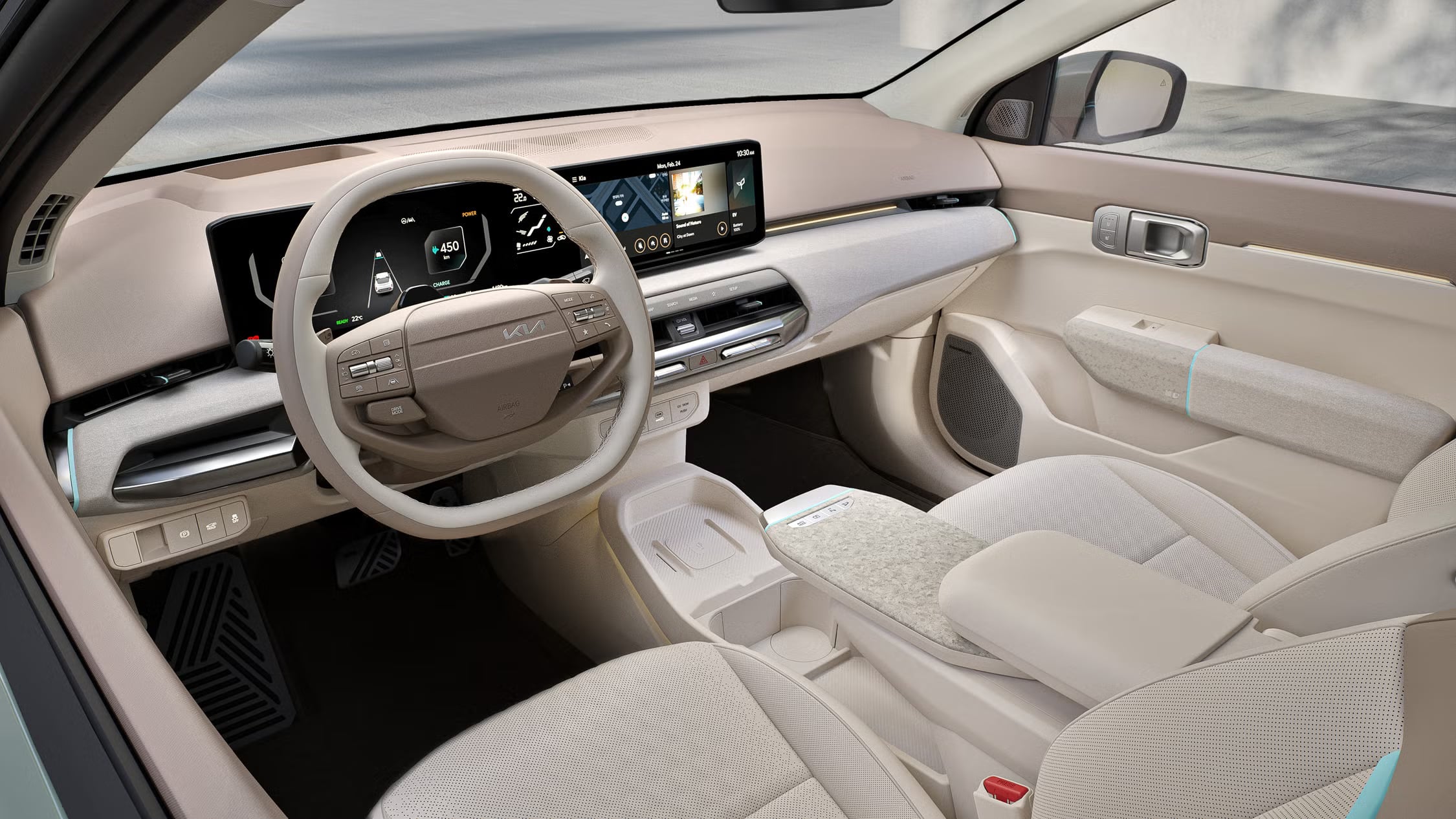 Modern Kia EV interior with widescreen displays and light-colored seating.