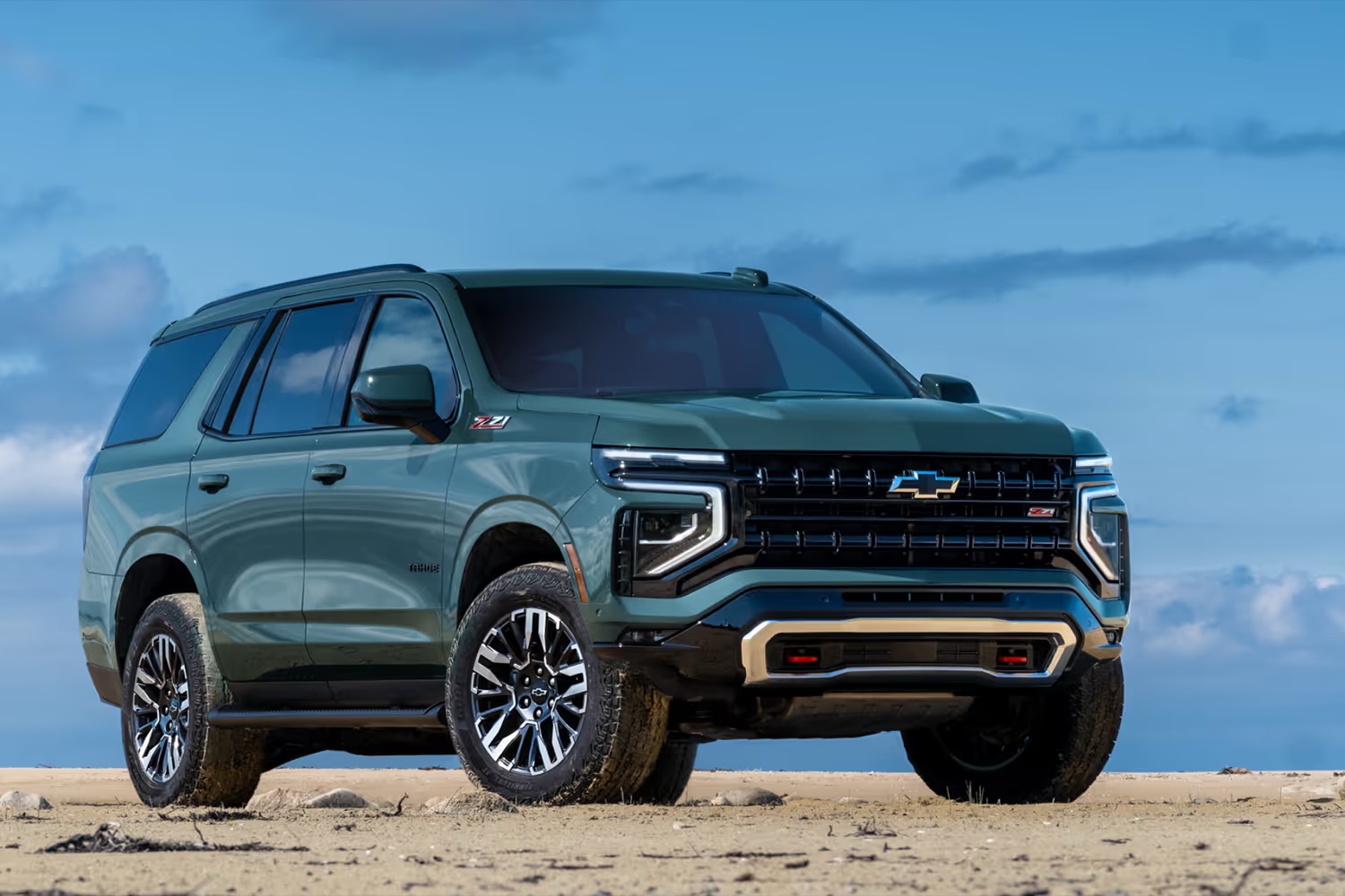 Green Chevrolet Tahoe Z71 parked on sandy terrain