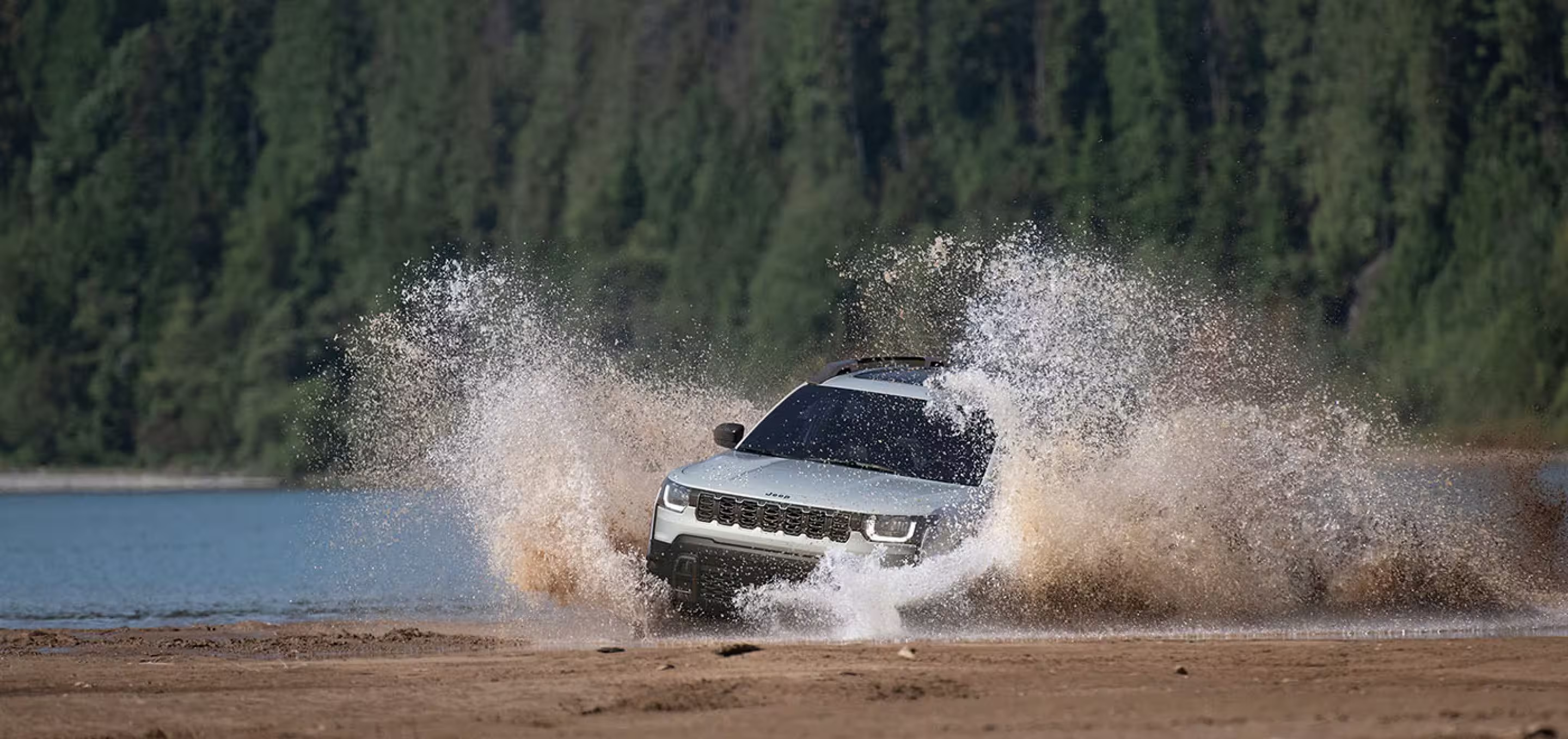 Jeep SUV traveling through shallow water
