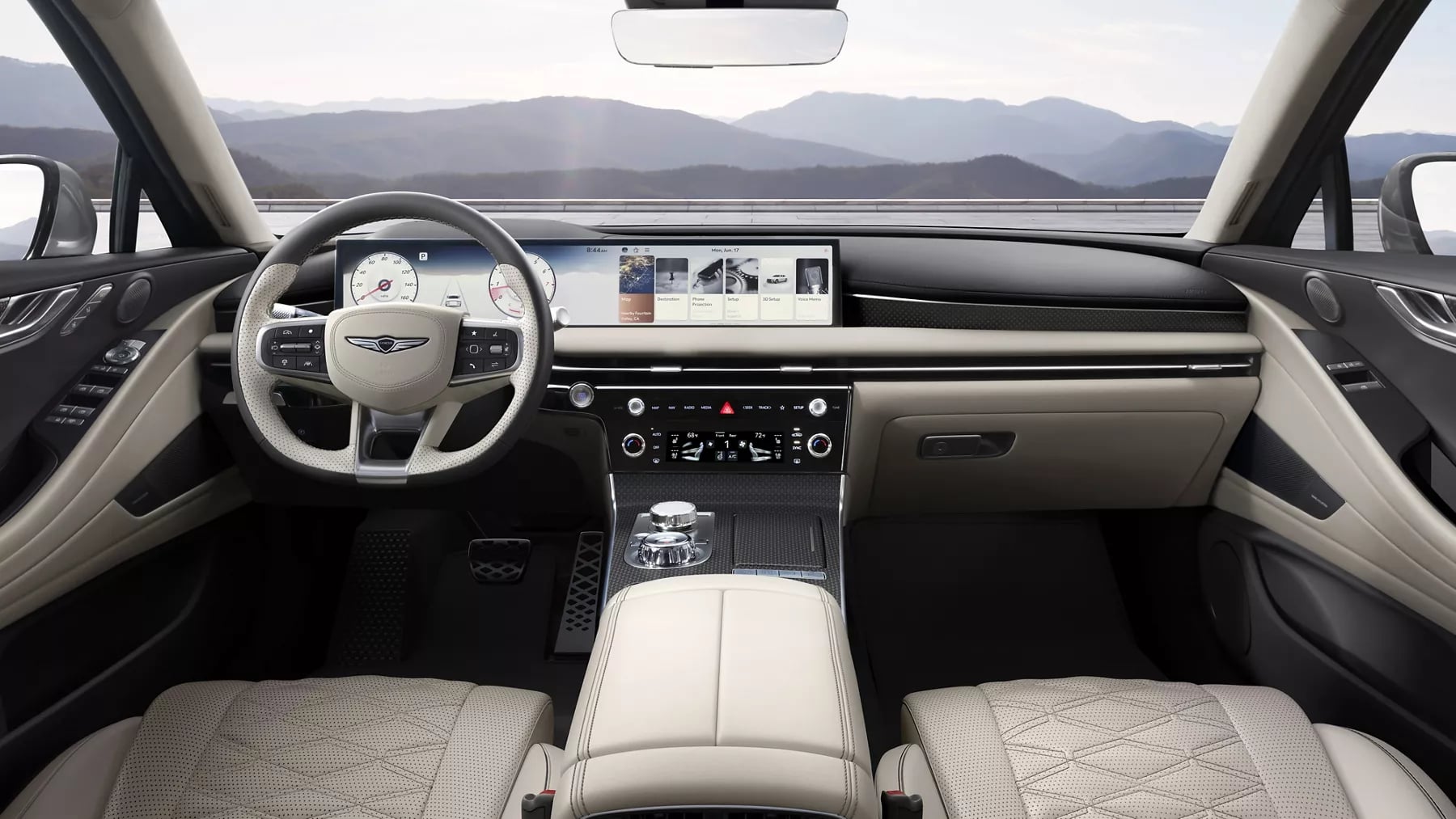 Interior of a Genesis luxury vehicle featuring a wide panoramic display screen and cream leather upholstery.