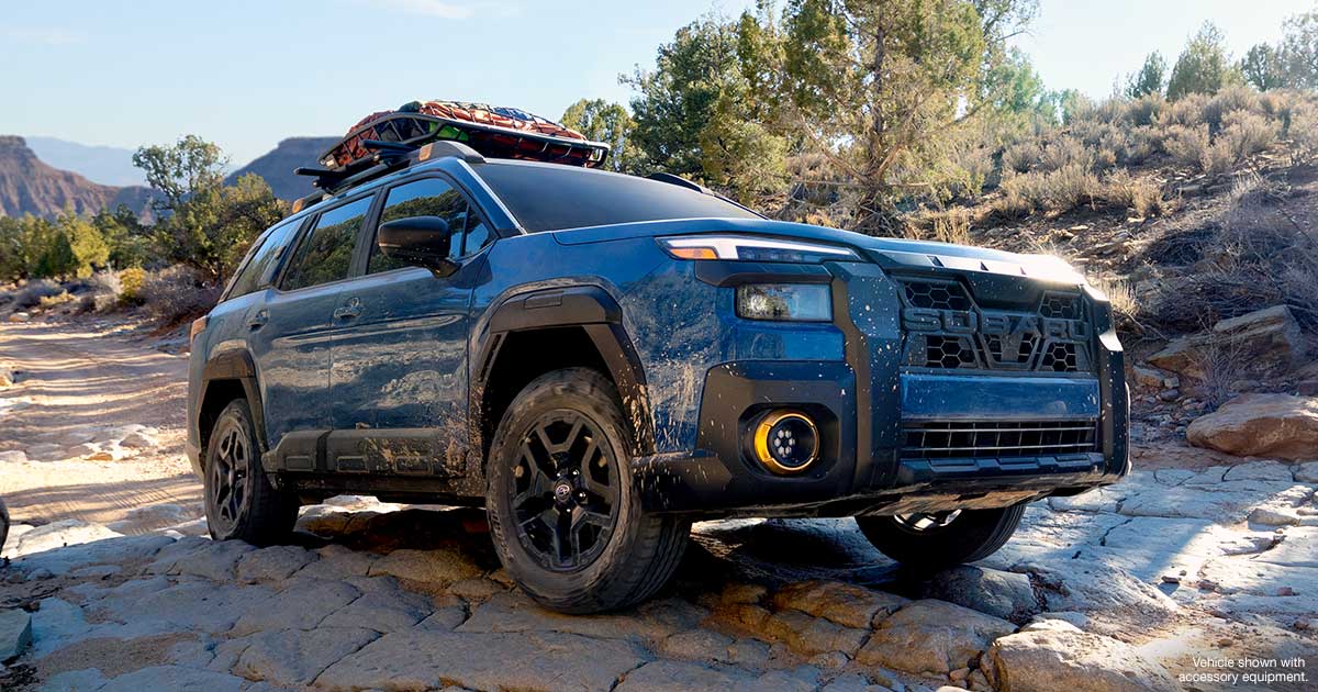 Close up of the Subaru Outback Wilderness tackling a rocky incline with its superior ground clearance.
