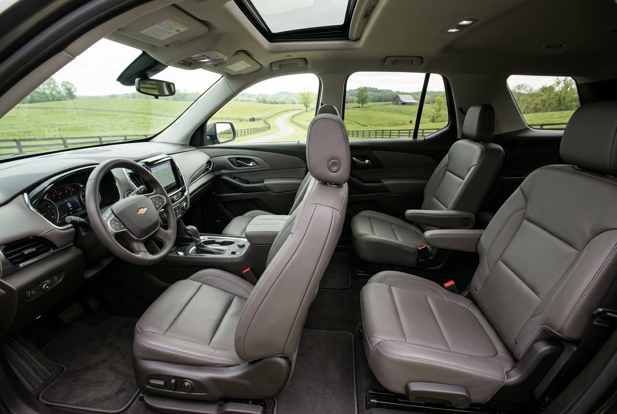 2027 Chevrolet Traverse interior, wide view of the spacious three-row cabin with comfortable seats and modern dashboard, soft natural light with Kentucky farmland visible through the windows, realistic automotive interior photography, no people, no text or logos (Representative image for illustration purposes only. Actual vehicle may vary based on trim and configuration.)