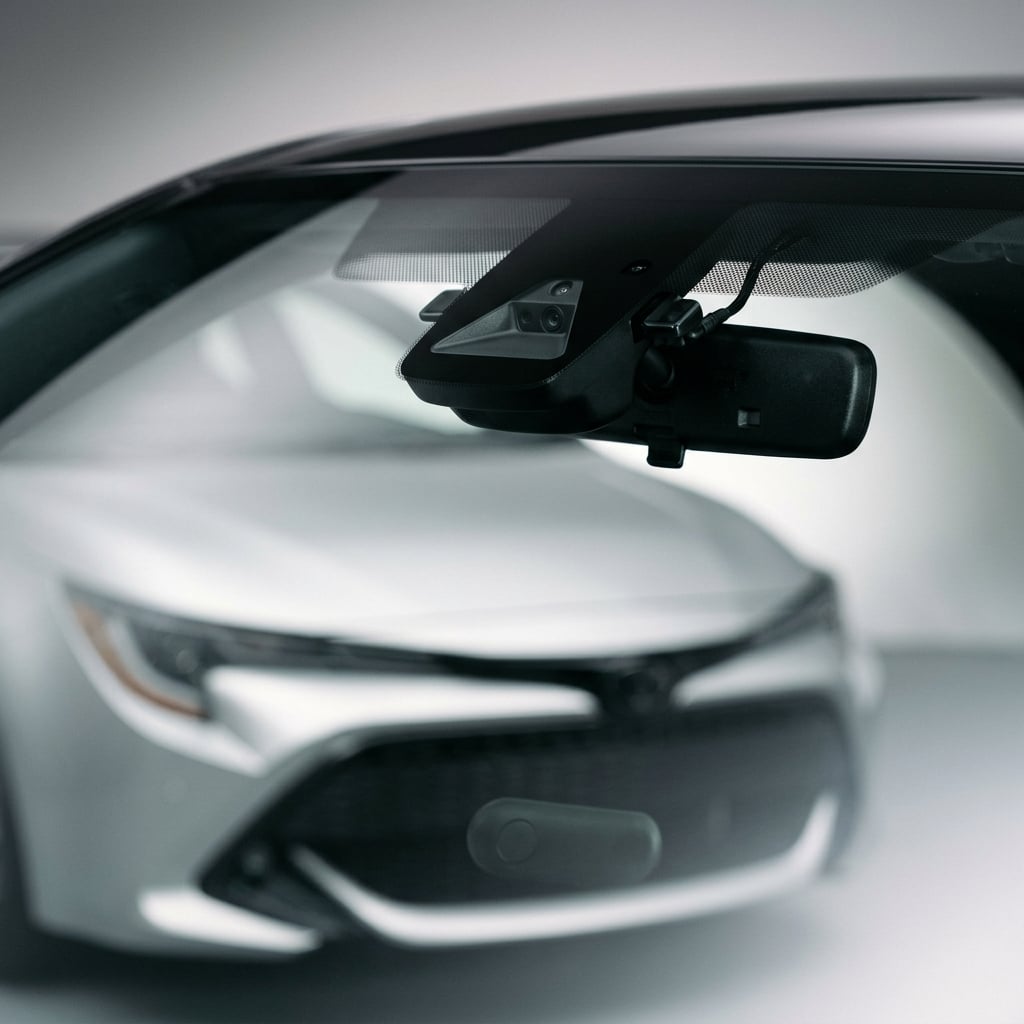 Close-up of the Toyota Safety Sense 3.0 forward camera and radar sensor