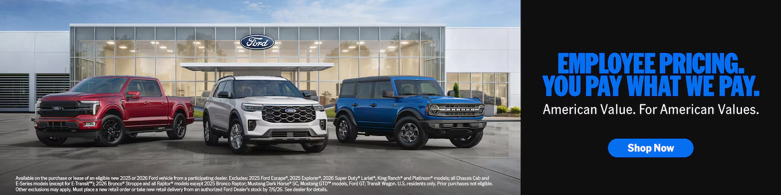 A wide shot of a Ford dealership with Employee Pricing banners and a line of new Ford F-150 and Explorer models.