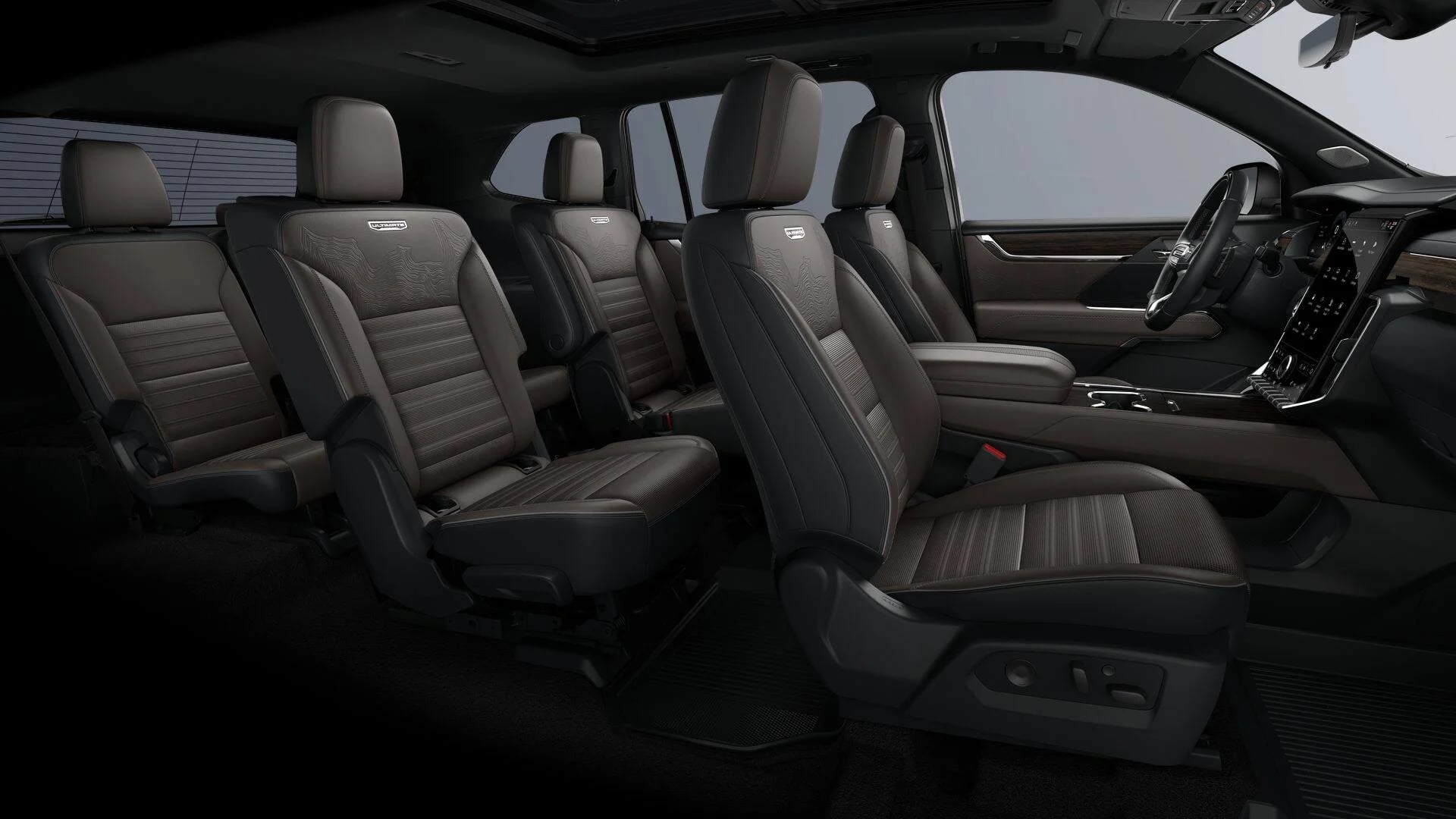 Interior view of a luxury SUV featuring three rows of dark brown leather seating and a modern dashboard.