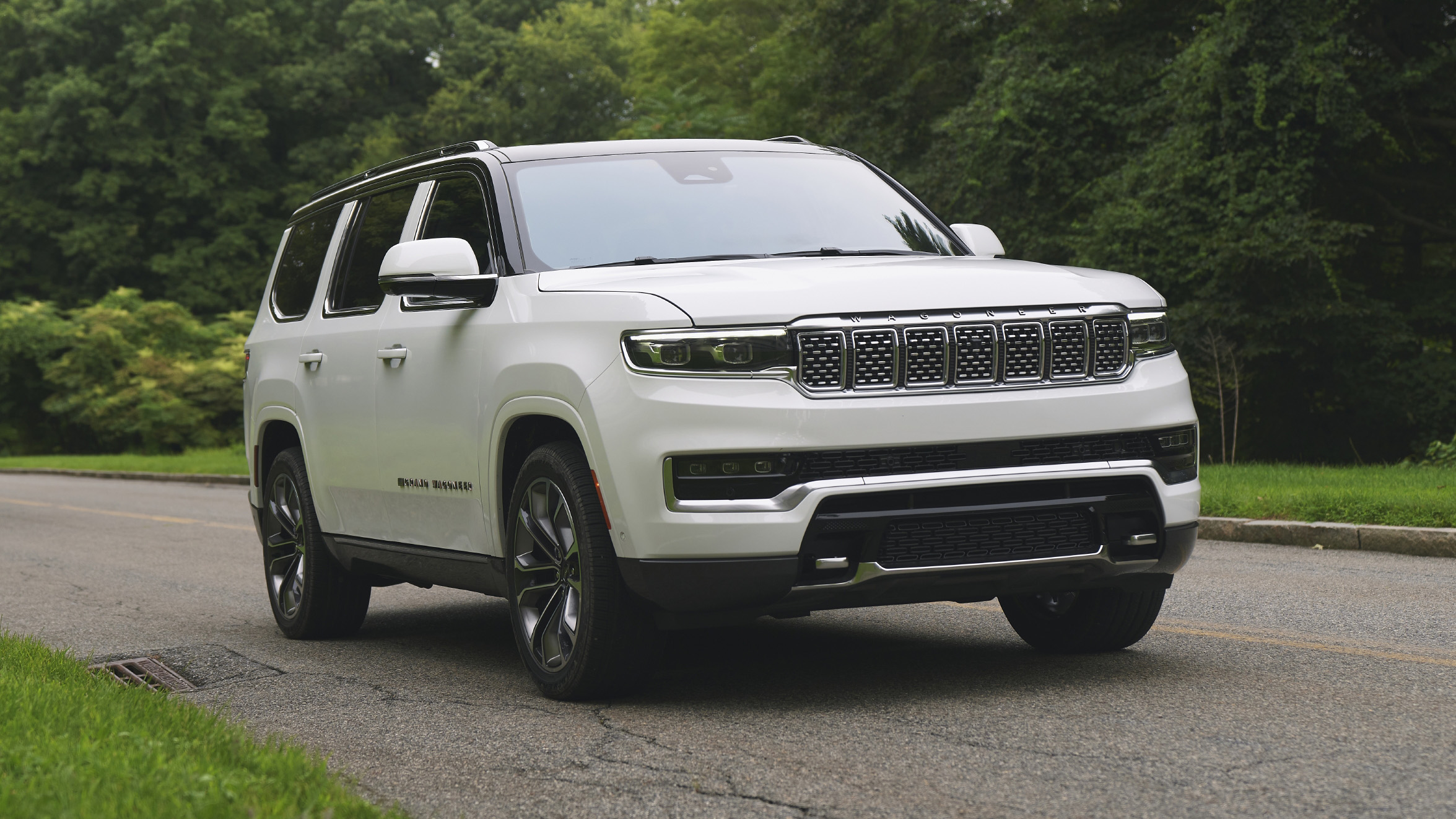 A sleek 2026 Jeep Grand Wagoneer L parked in a scenic Illinois landscape during spring.