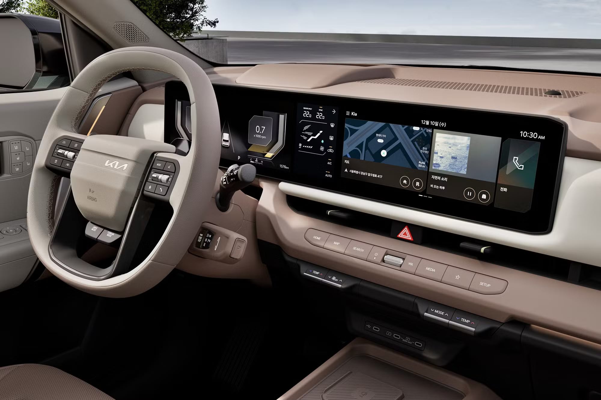 Beige leather interior of a modern Kia vehicle featuring a digital dashboard display and multi-function steering wheel.
