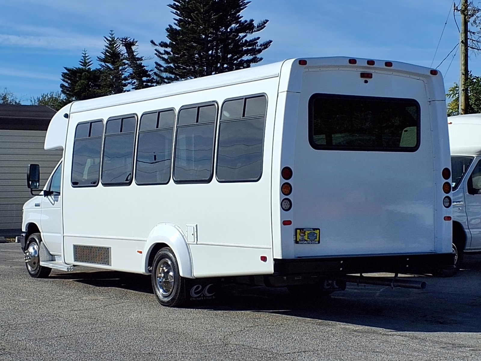 A shuttle bus with large windows for sightseeing.