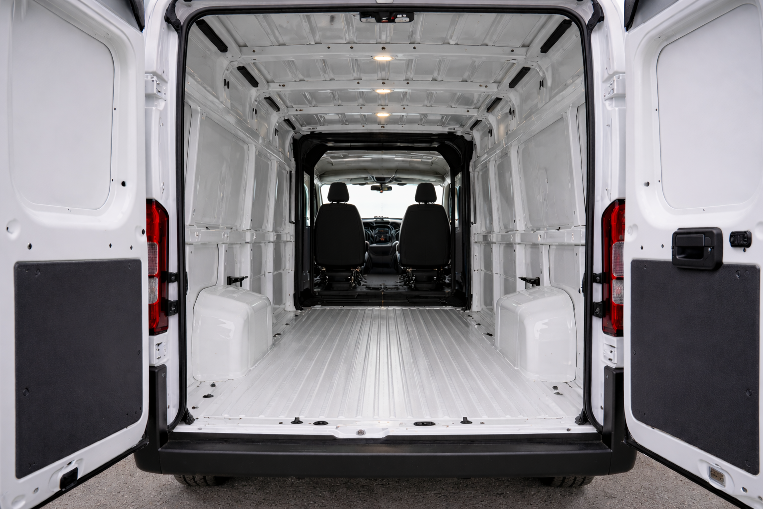 Wide cargo area of a RAM ProMaster showing the flat floor and vertical walls