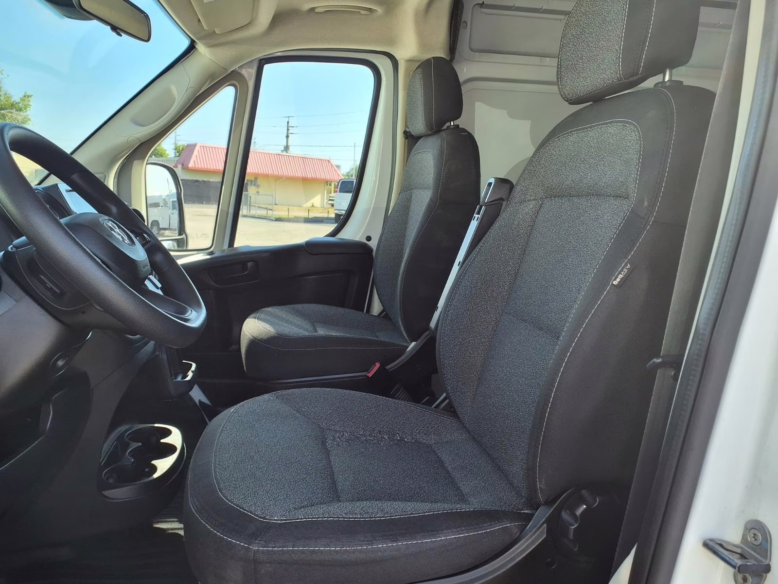 Interior view of a RAM ProMaster 2500 with professional shelving upfits