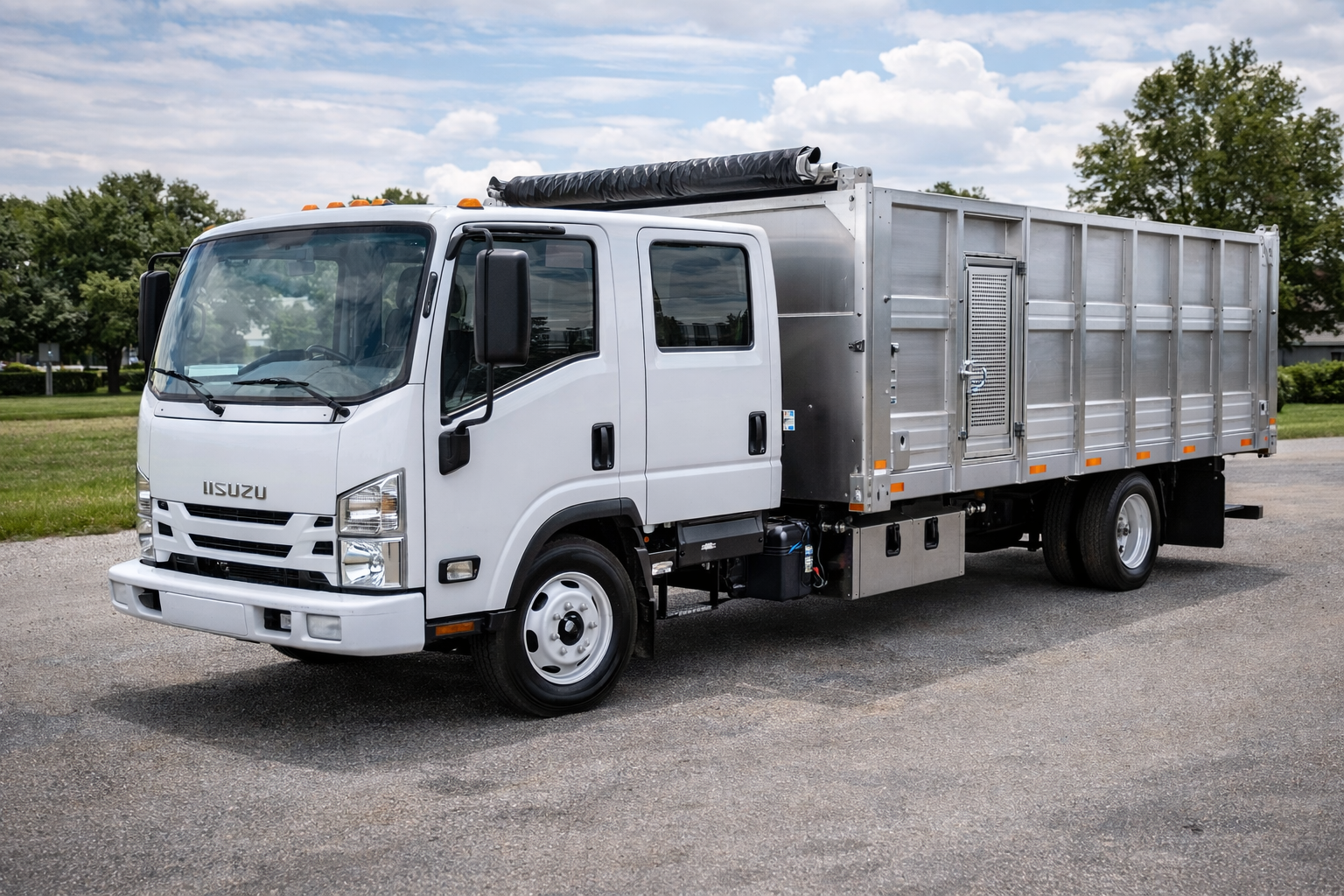 Isuzu NPR with a landscape dump bed and tool storage