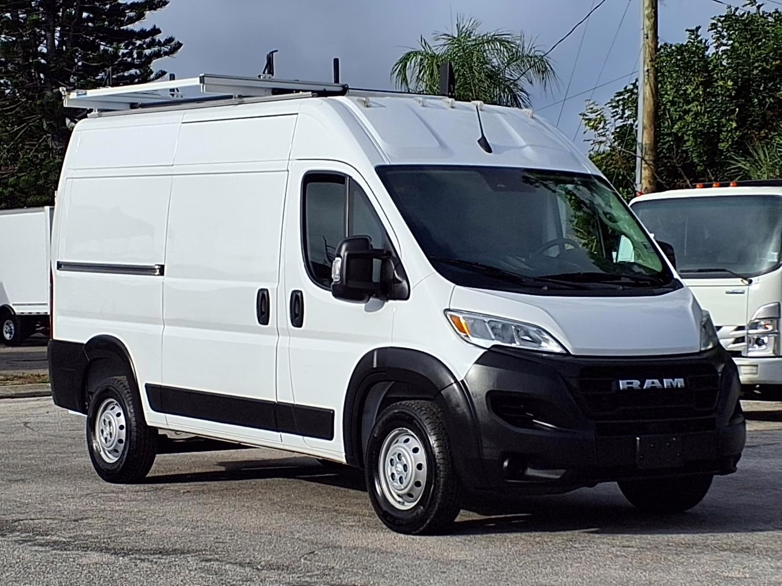 White Ford Transit and Ram ProMaster cargo vans
