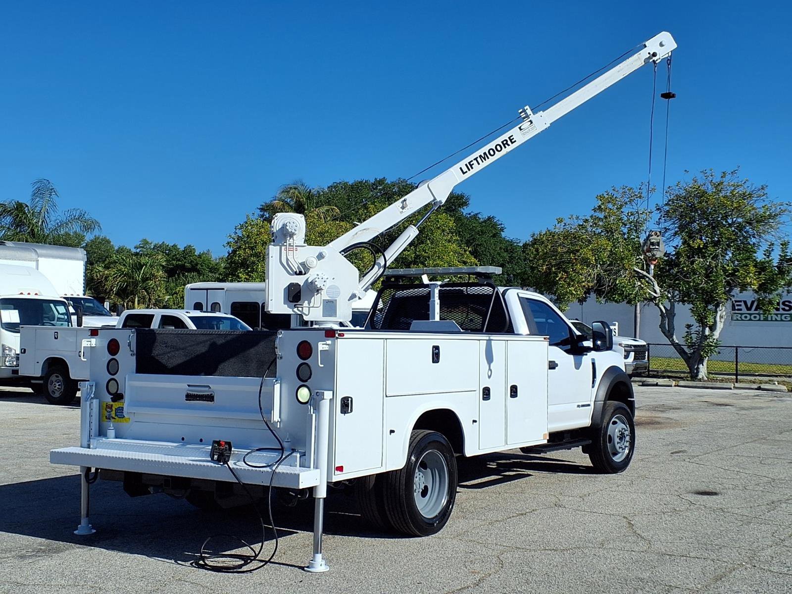 A service truck featuring a telescopic crane for vertical lifting and precise placement