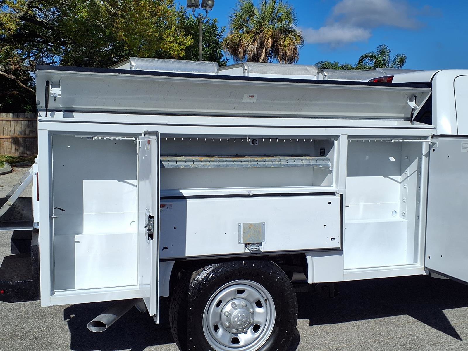 A side view of a utility body showing the condition of the door seals and hinges.
