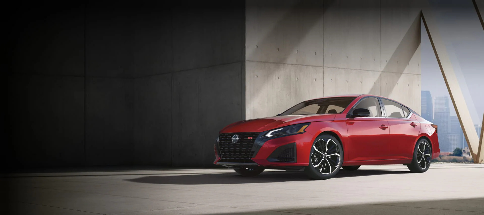 A sleek 2026 Nissan Altima parked in front of a modern architectural building in North Carolina