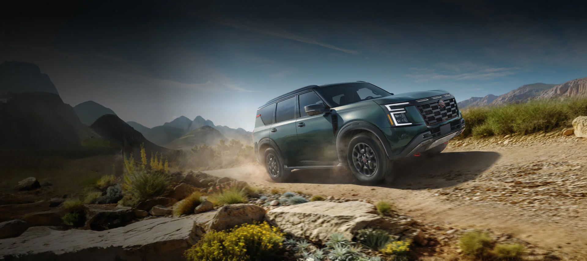 A front perspective view of the redesigned 2026 Nissan Armada parked in a scenic North Carolina landscape