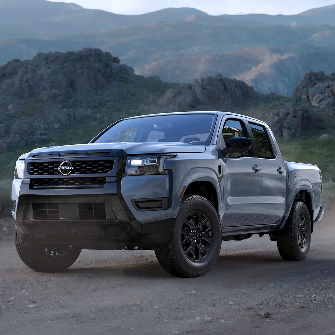 Frontier PRO-4X showing off its suspension travel and Bilstein shocks on rocky terrain