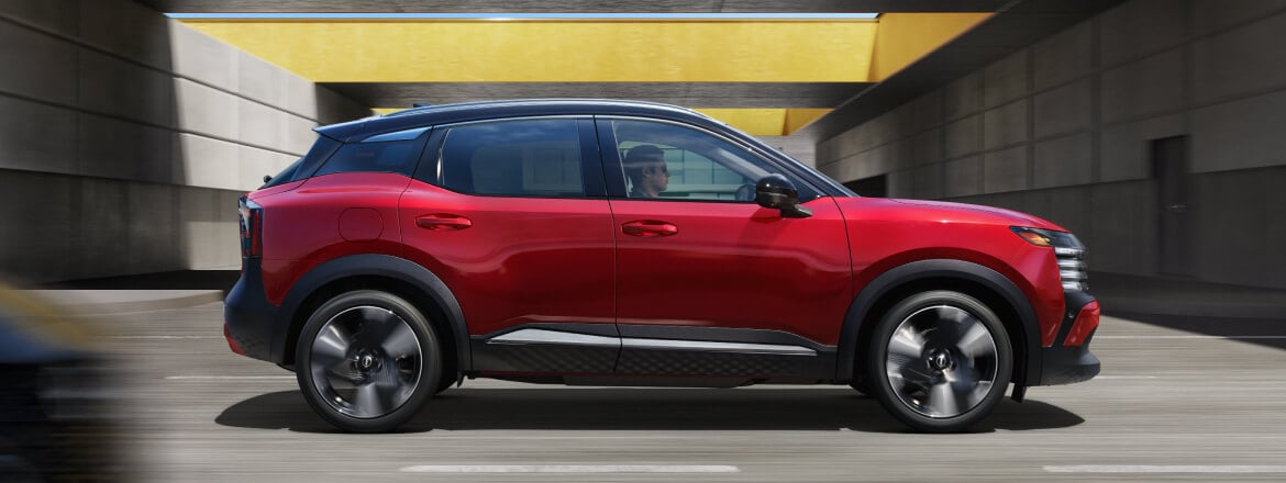 A wide-angle shot of the 2026 Nissan Kicks in a vibrant color, showcasing its bold redesign and aggressive urban stance.