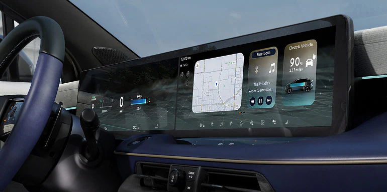 Interior view of the 2026 Nissan LEAF showing the new dual widescreen displays and premium materials.