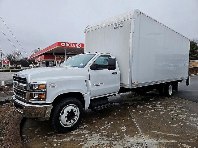 A 2023 Chevrolet Silverado 6500 HD configured as a dump truck working on a construction site in North Carolina