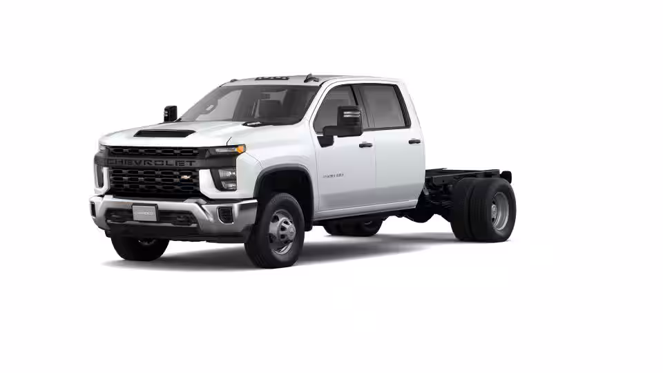 A 2024 Chevrolet Silverado 3500 HD showcasing its massive chrome grille and heavy-duty stance against a North Carolina landscape.