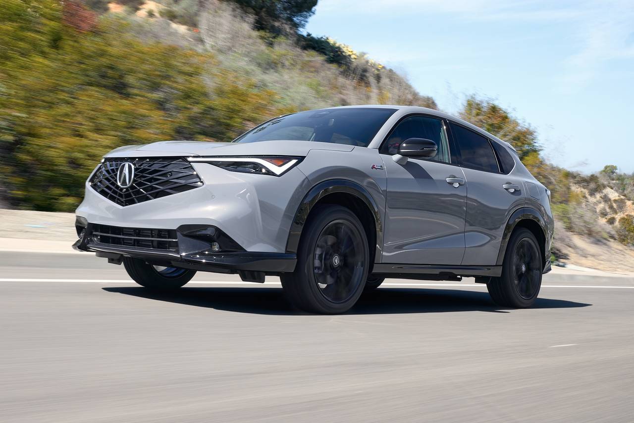 2026 Acura ADX premium compact SUV driving on a highway.