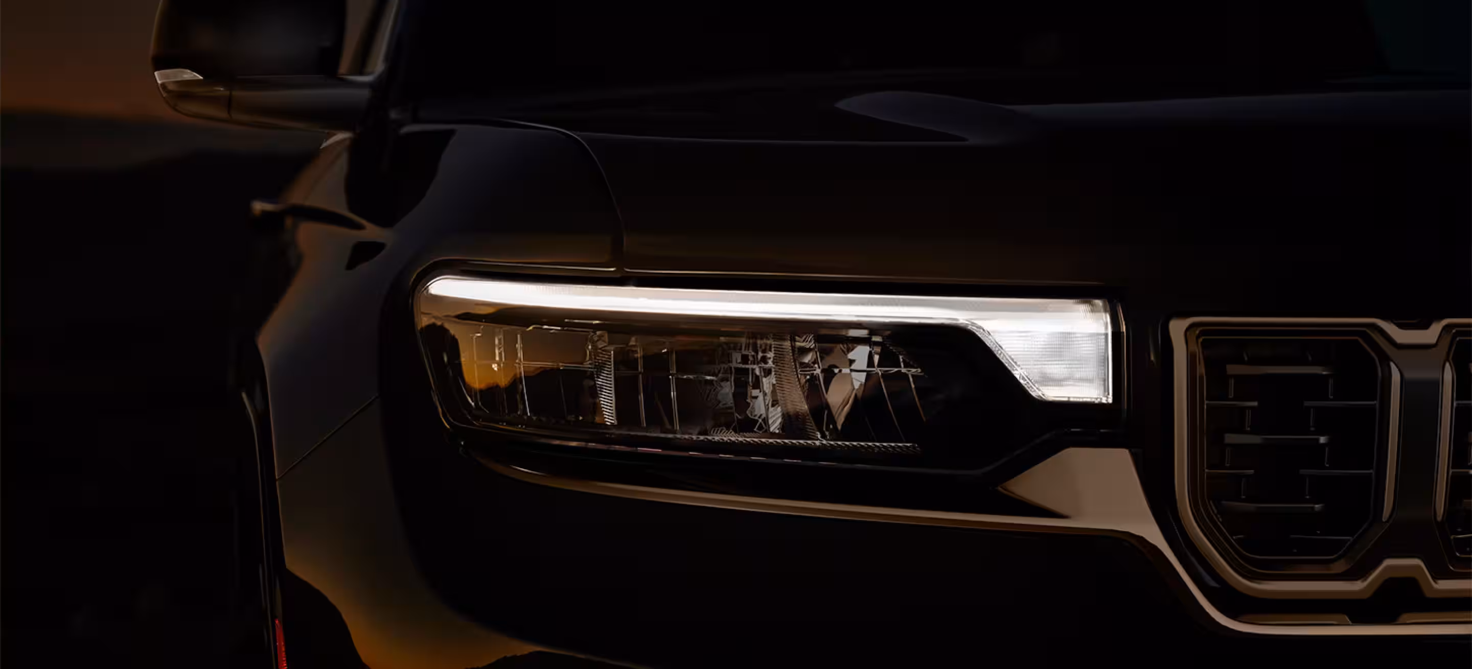 2026 Jeep Grand Cherokee exterior front view showcasing redesigned seven-slot grille and LED headlights