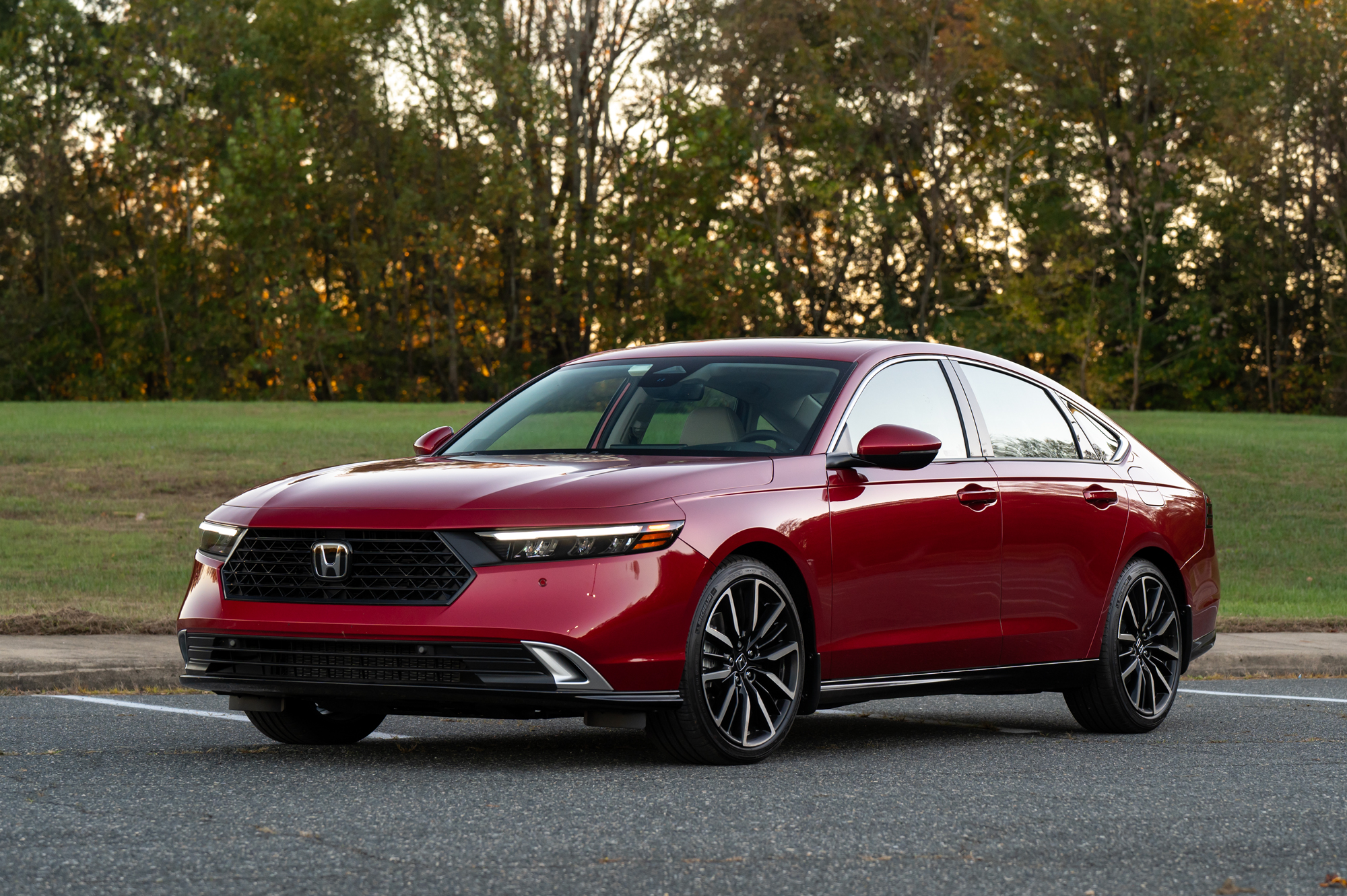 Red 2023 Honda Accord sedan parked on asphalt.