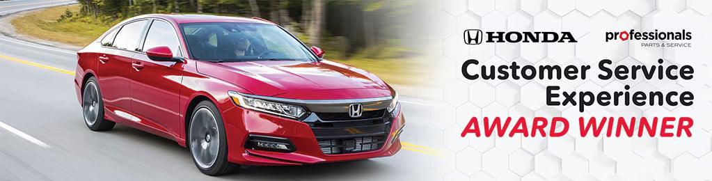 A red Honda sedan driving on a highway alongside promotional text for the Honda Customer Service Experience Award.