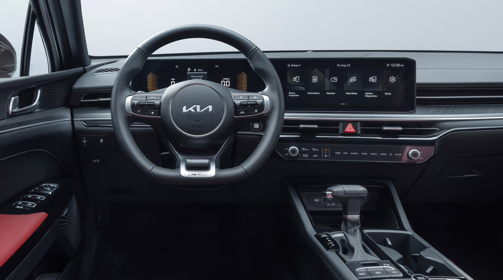 2026 Kia K5 dashboard with wide digital display and steering wheel.