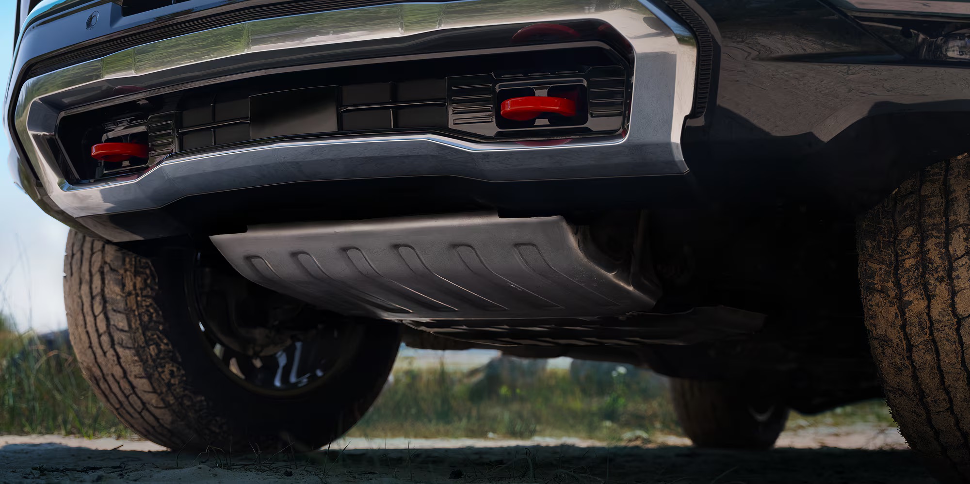 Close-up of Tahoe front underside showing red tow hooks and skid plate
