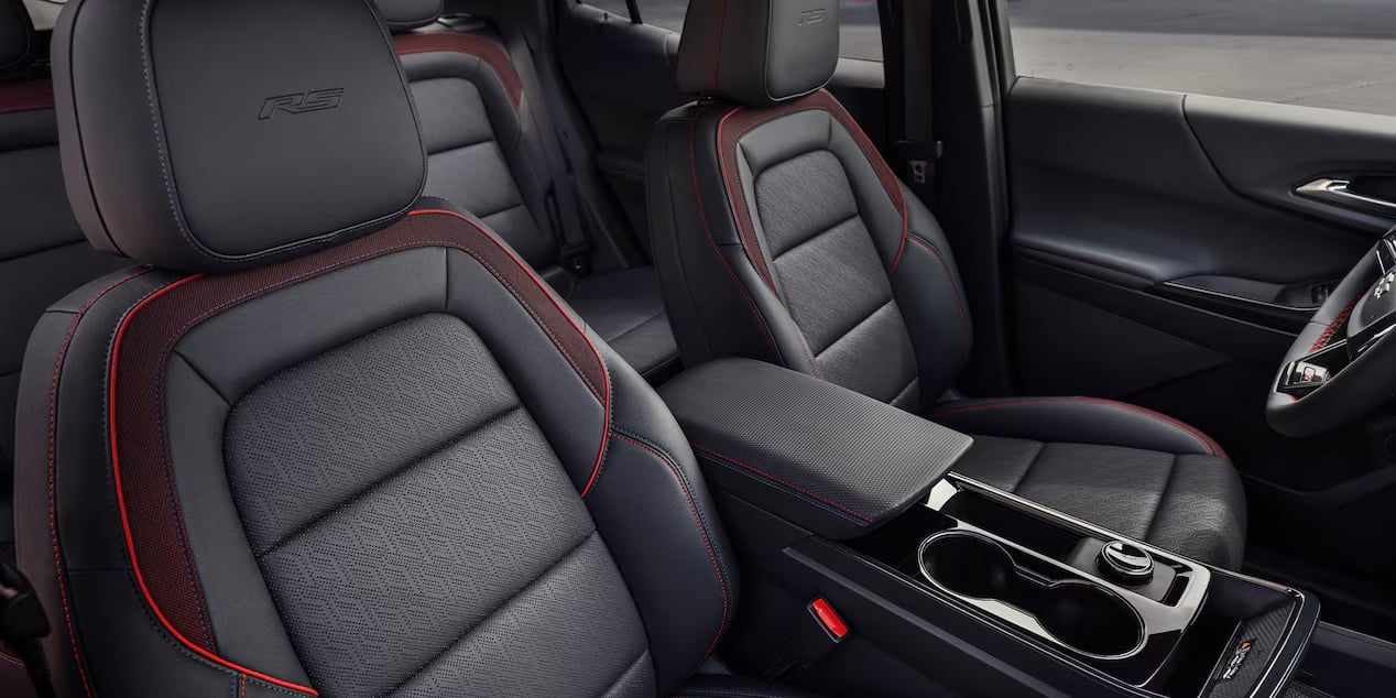 Black Chevrolet Equinox interior with red trim stitching and RS badging.
