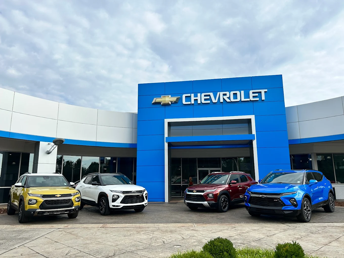 Wide exterior shot of the Guntersville Chevrolet dealership building near the water in Guntersville, AL