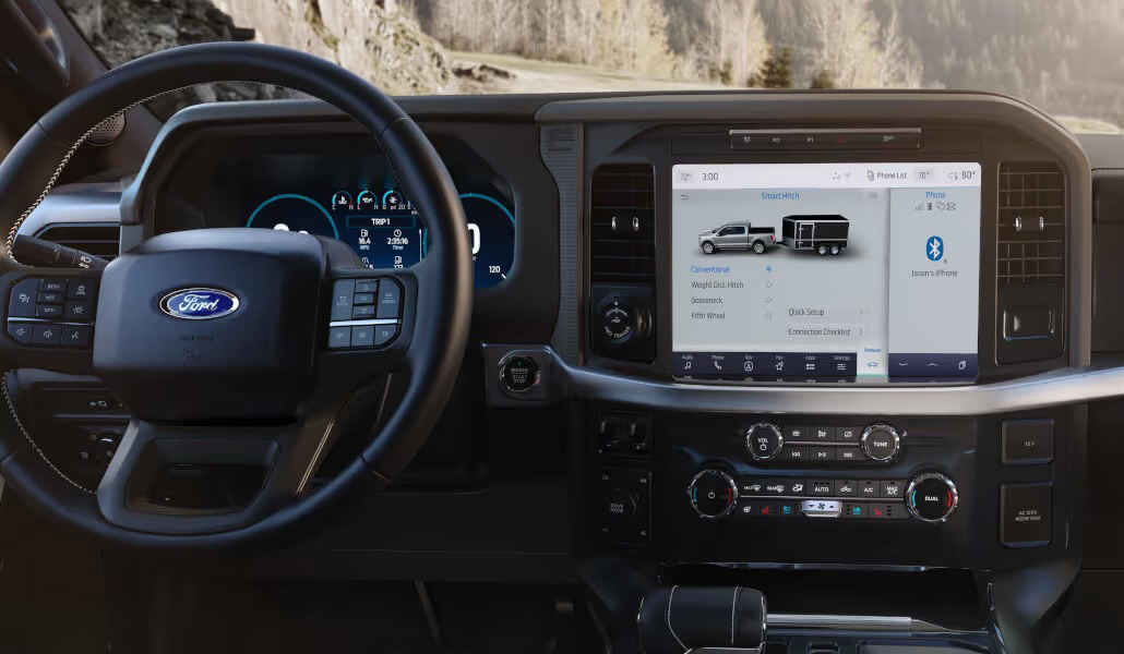 Interior dashboard of a modern Ford pickup truck showing the digital instrument cluster and touchscreen interface.
