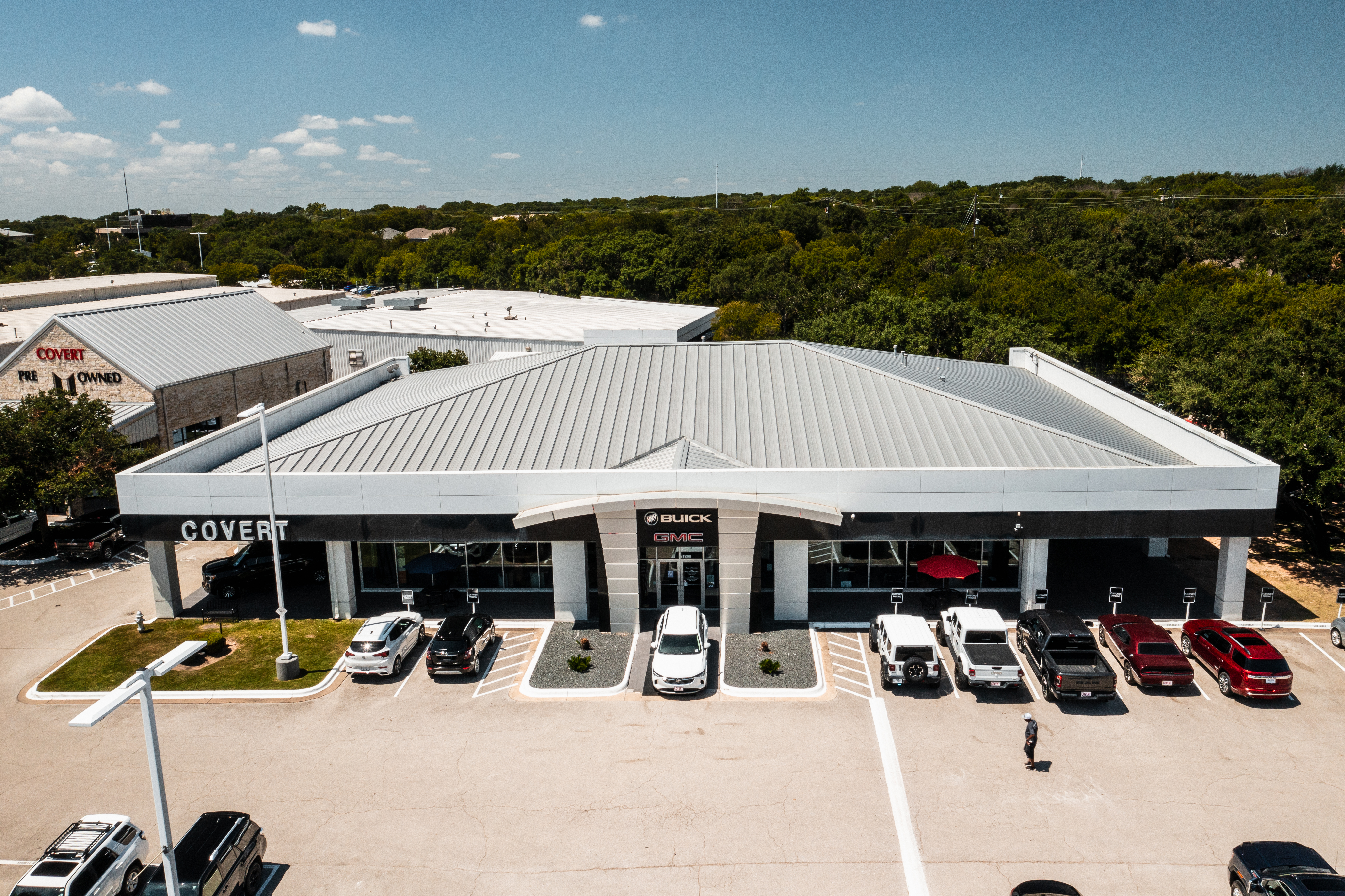 The exterior of the Covert Buick GMC dealership in Austin, TX, showing a welcoming and professional environment.