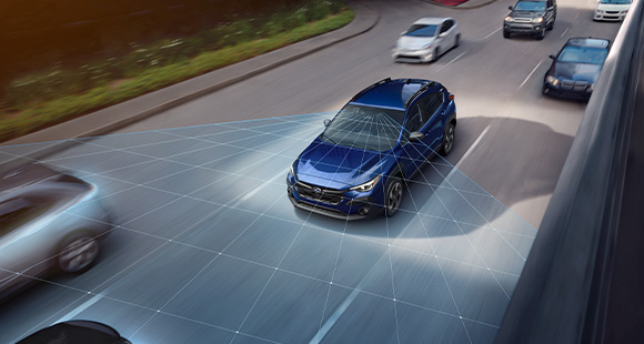 Blue Subaru Crosstrek with vehicle safety technology overlay.