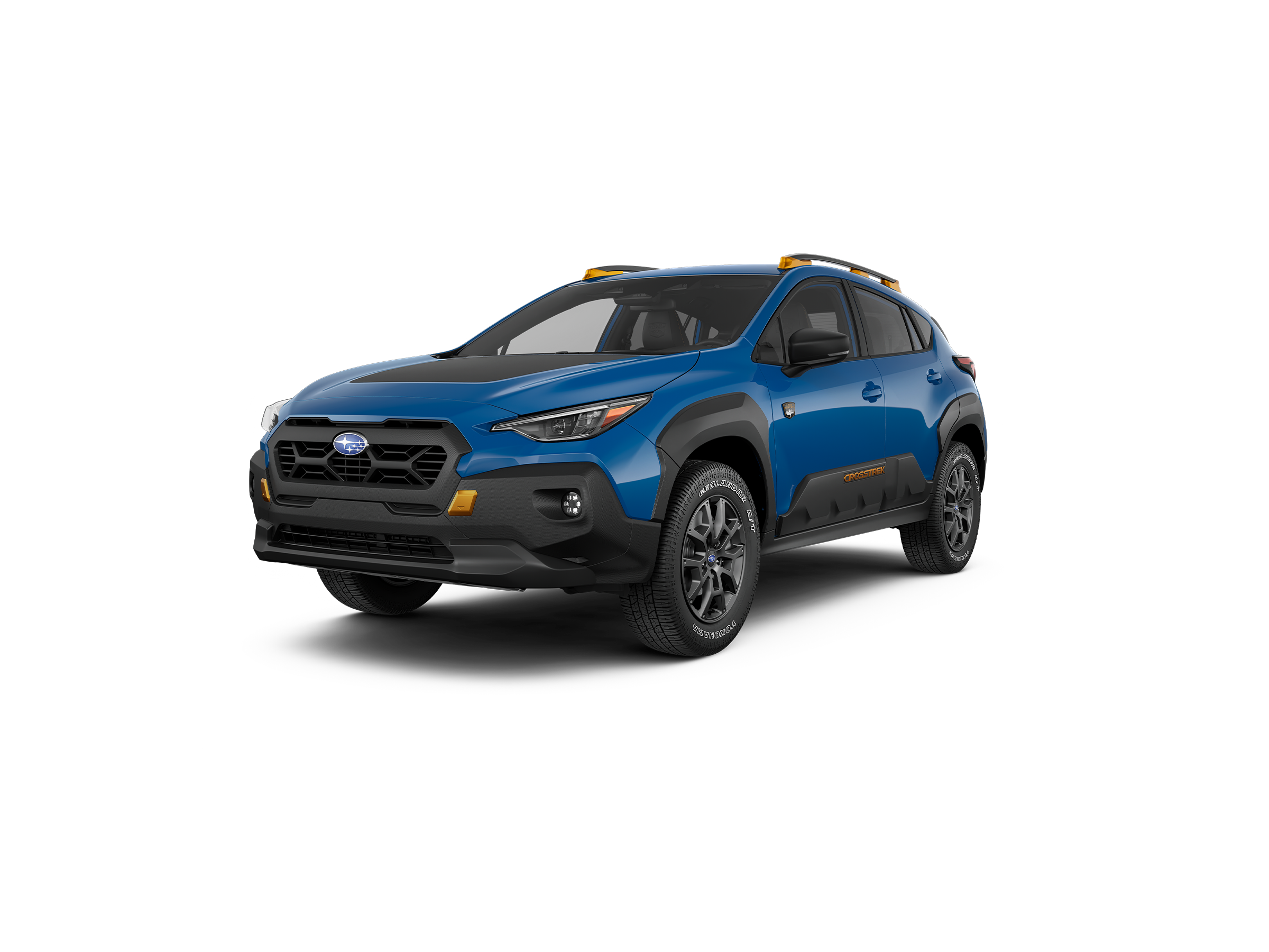 Blue 2024 Subaru Crosstrek Wilderness SUV on black background.