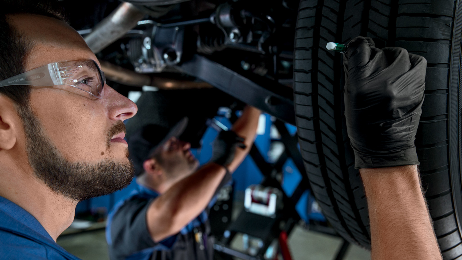 A Subaru Forester being inspected by a certified technician at Sunset Hills Subaru