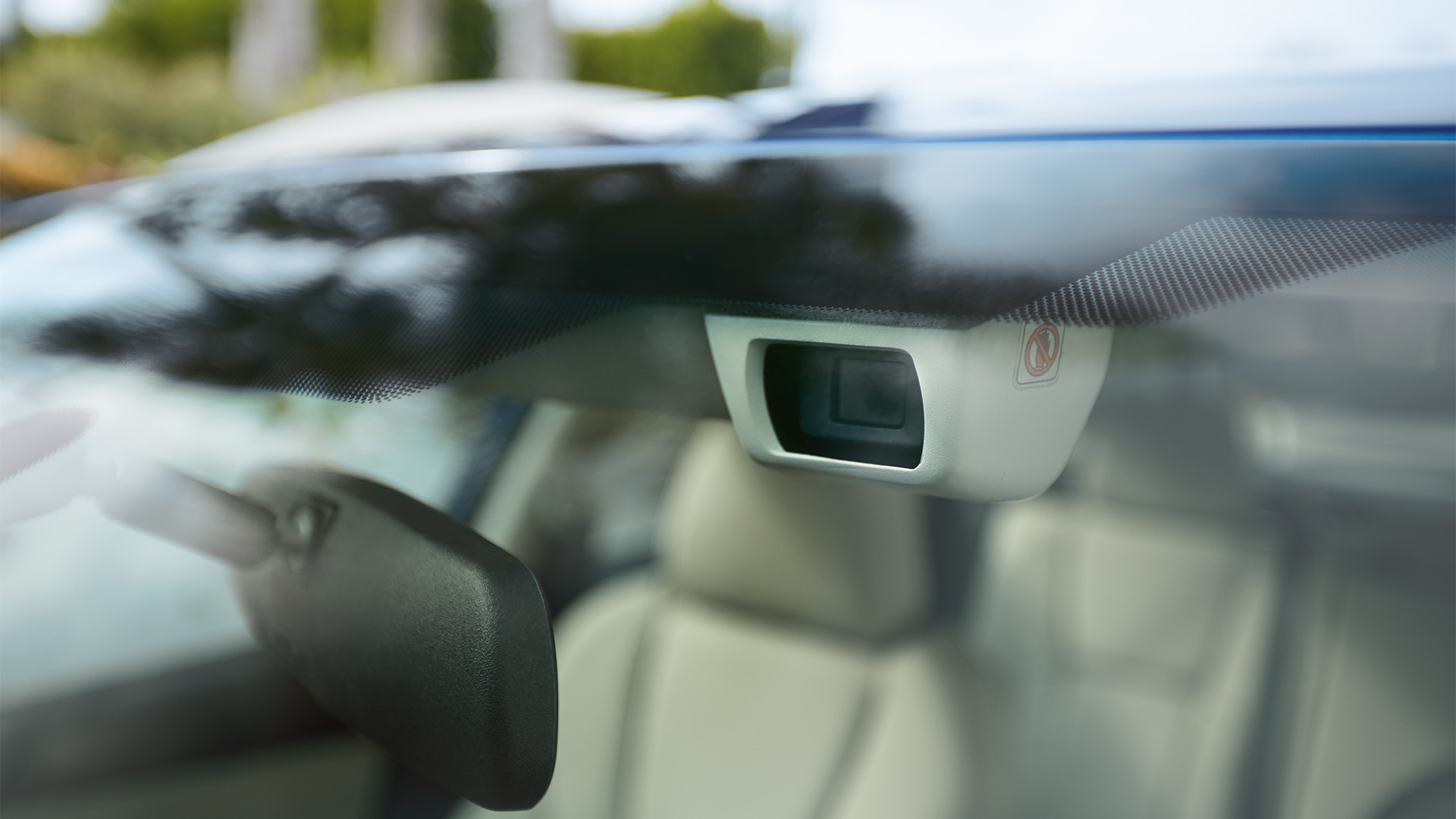 Close up of Subaru EyeSight cameras mounted near the rearview mirror