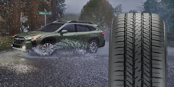 A 2019 Subaru Forester driving through a scenic Missouri road showcasing tire grip and AWD stability.