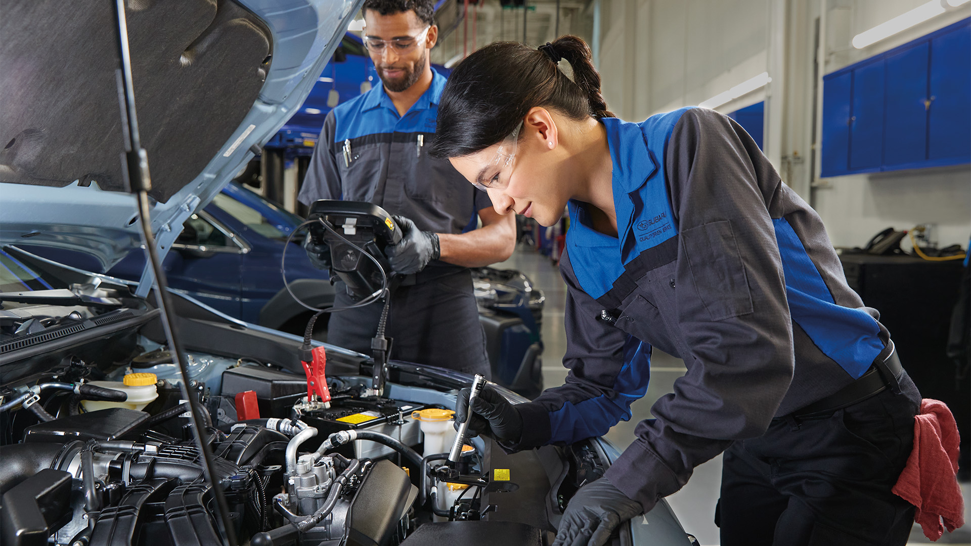 A Subaru driving through snow on one side and a sunny highway on the other, representing Missouri weather