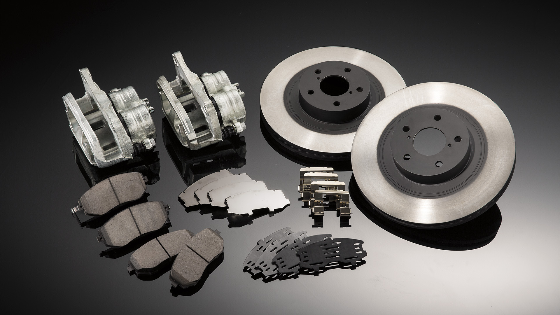 Genuine Subaru parts displayed on a shelf.