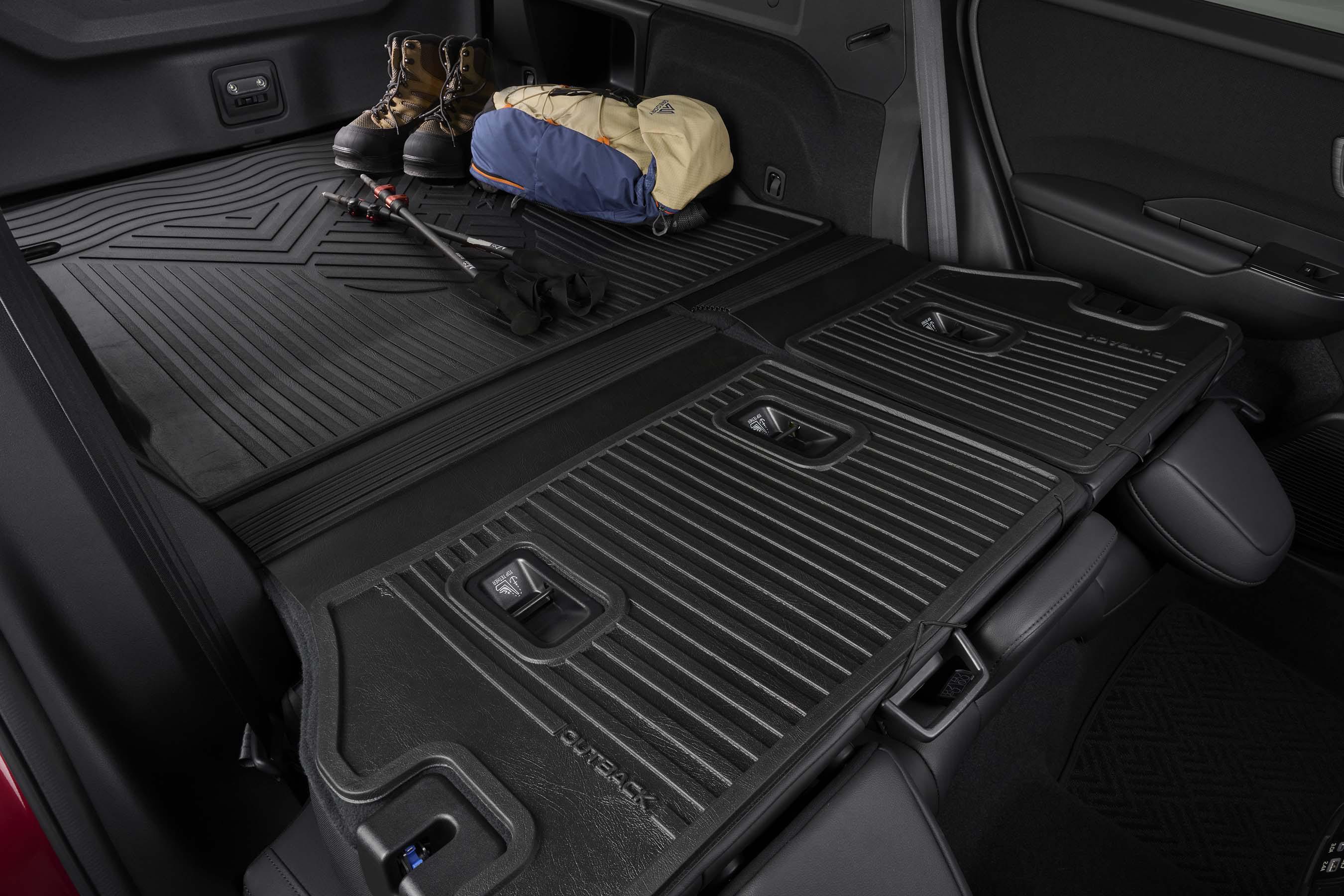 Subaru Outback trunk and rear seats covered with heavy-duty rubber protective cargo mats.