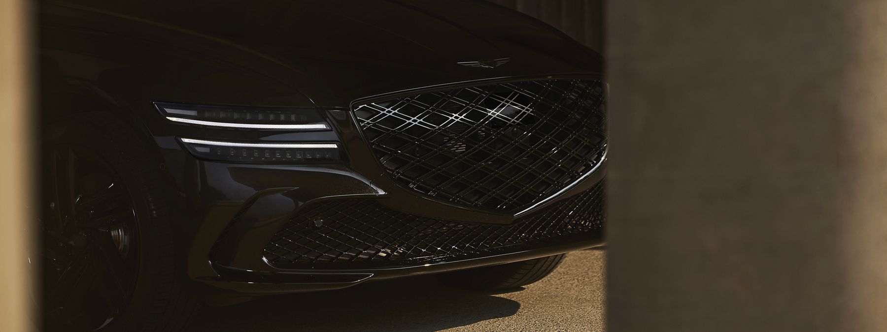 Genesis G80 exterior profile with elegant sedan styling.