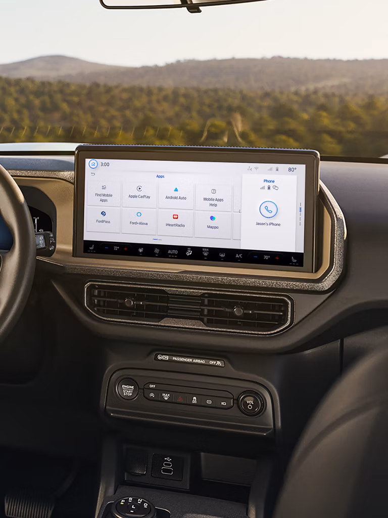 The 13.2-inch SYNC 4 touchscreen displaying navigation and music controls.