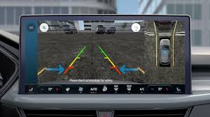 A driver using the 360-degree camera system on the Ford Escape's large center touchscreen.