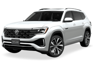 White Volkswagen Atlas SUV parked on a dark surface.